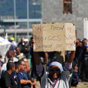 Hundreds of residents of the Joe Slovo informal settlement demonstrate against the lack of services provided by the government in the Gugulethu township on the outskirts of Cape Town.