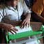 Cambodian children using low-cost laptop