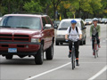 Bikes and cars follow the rules of the road.