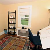Because this room is too small for a bedroom, the home stager made it into a mock drafting room, for people to imagine themselves planning home improvements that they may in reality never get around to building.