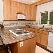 Kitchens, like bathrooms, are staged clean and de-cluttered. The bowl of fruit on the counter? Those are wax apples. Like home staging, they're all for looks, not for real life.