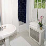 Staging bathrooms is simple. Above all, clean! A new set of fluffy white towels helps create a good impression.