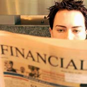 A man reads The Financial Times in London 