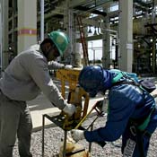 Workers at a Petrobras aviation fuel station 