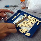 A pharmacist counts pills 