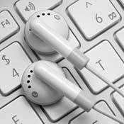 Mp3 player headphones on a keyboard 
