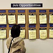 Job seeker looks at listing board 