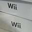 Boxes of Wii Nintendo consoles stacked up shop