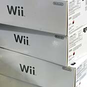 Boxes of Wii Nintendo consoles stacked up shop 