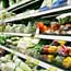 Shopper browses vegetable display