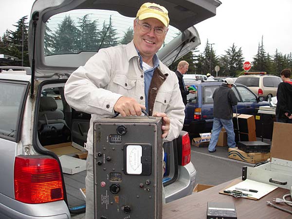
                Silicon Valley engineer Jeff Anderson prepares  to sell an old piece of electronics at the flea market in Cupertino, Calif. Anderson is usually a shopper, but once a year he clears out his garage by selling old parts he no longer needs.
                                    (Tamara Keith)
                                