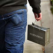 Shopper carries a Nordstrom bag 