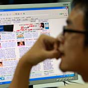 Man surfs the Internet in Beijing 