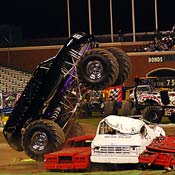 An escalade crushes some cars 