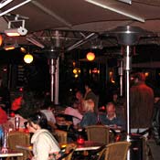 Diners eat under heat lamps at Berlin's Hackescher Markt.