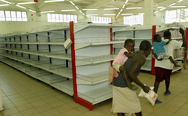 
                Shoppers in an almost empty supermaket in Harare, Zimabwe.
                                    (Desmond Kwande/AFP/Getty Images)
                                