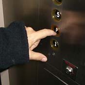 Lisa pushes the elevator button for ground/parking level. As Lisa lives on the 18th floor, rush hour can sometimes seriously impact her travel time.