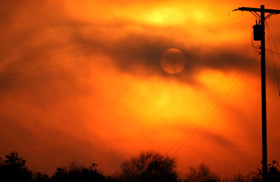 
                    Powerful Santa Ana winds stoked wildfires in Southern California this month. Smoke and clouds camouflage the morning sun on October 26, 2007, in Oceanside, Calif.
                                            (Spencer Platt / Getty Images)
                                        