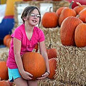 Girl in pumpkin patch 