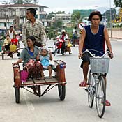 Rickshaw and bicycle riders in Myanmar 