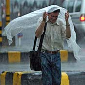 Indian tourist runs through monsoon 