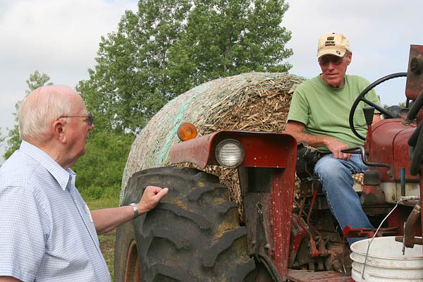 
                Farmers Fred Buschman, left, and Tony Snyder envision a fossil-free energy future for their town. "To me, the whole concept makes sense. We just got into an era when everything was throwaway -- buy something and use it for a little bit, then throw it away then buy something new," Buschman says. "We can't do that any more."
                                    (Sam Eaton)
                                
