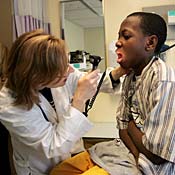 Doctor examines boy 