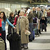 Travelers wait in line at O'Hare Airport 