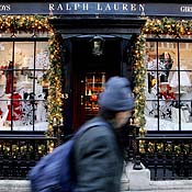 A shopper passes a Ralph Lauren store 