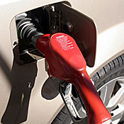 A gas nozzle in the fuel port of a car. 