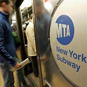 People enter subway car in Times Square 