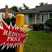Reduced price sign in front of house 