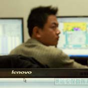 A tech worker at his monitors 
