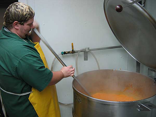 
                A Bar Harbor Foods worker stirs lobster bisque.
                                    (Steve Tripoli)
                                
