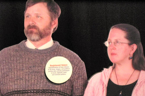 
                    The badge on these photos explains that these are typical voters.  They look a little weary or are they really scared?
                                            (Kyle Gassiott)
                                        