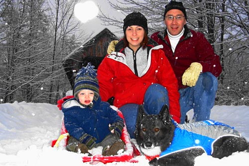 
                    Mike Pacheco, front man for Groove Alliance and a Major in the U.S. Army, with son Trevor, wife Kerri, and the family hound, Freya, a Karelian Bear Dog.
                                            (Courtesy Mike Pacheco)
                                        