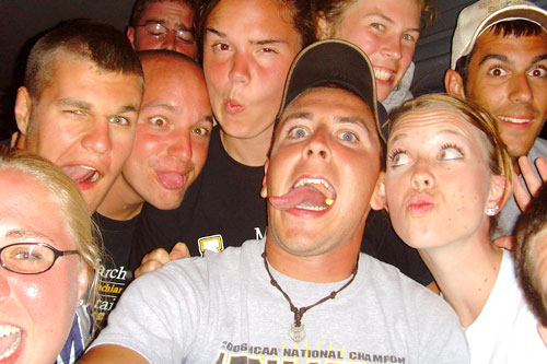 
                    The bus ride from Boone, NC to Ann Arbor, MI took 12 hours. In this picture, the band members let off some steam.
                                            (Kameron Radford)
                                        