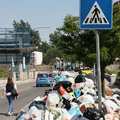 Trash collects on a street in Naples 