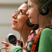 Mother and daugher listen to audio tour 