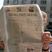 Woman reads the Wall Street Journal 