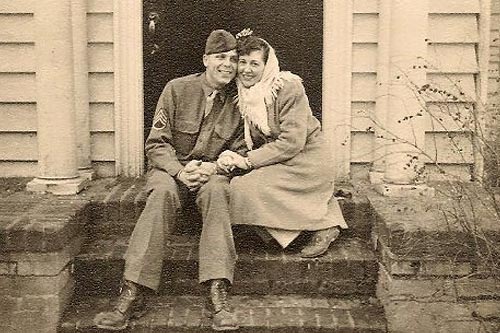 
                    Boarders sit on the front porch of Lucinda Alsobrook Coulter-Burbach's childhood home.
                                            (Courtesy Lucinda Alsobrook Coulter-Burbach)
                                        