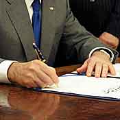 President Bush signs legislation. 
