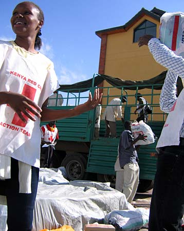 
                Volunteers load donated clothing into a container headed to displaced people in rural Kenya.
                                    (Sara Nics)
                                