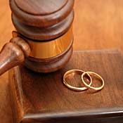Judge's gavel and wedding bands 