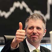 Stock trader gives thumbs up 