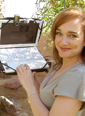 
                    Twenty-nine-year-old singer Jody Gnant streams every moment of her life on the Internet. She is pictured here holding the laptop that she uses to broadcast her life.
                                            (Rene Gutel)
                                        