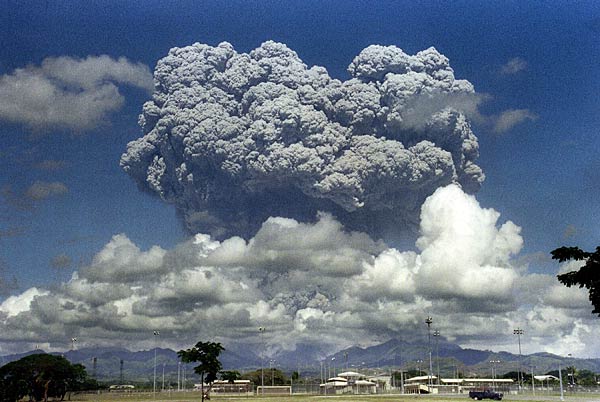 
                A giant mushroom cloud of steam and ash explodes out of the Mt. Pinatubo volcano in the Philippines in 1991. Particles from the volcano swirled in the upper atmosphere for more than two years, diffusing the sun's heat and cooling the earth. Could a simulated volcanic eruption be Plan B for reversing global warming?
                                    (Arlan Naeg/AFP/Getty Images)
                                