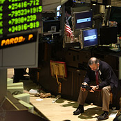 A trader sits at the New York Stock Exchange 