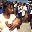 People line up to receive food donations in Haiti