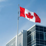 Canadian flag and office building 